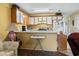 Open kitchen with white cabinets and appliances, seamlessly connected to the living area at 510 Fairwood Lakes Dr. # 16-I, Myrtle Beach, SC 29588
