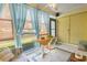 Bright sunroom featuring tile flooring, a ceiling fan, and a view of the canal at 510 Fairwood Lakes Dr. # 16-I, Myrtle Beach, SC 29588