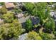 An aerial view of the complex with mature trees surrounding the building and green grass at 513 38Th Ave. N # 202, Myrtle Beach, SC 29577