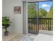 A great view to the lush greenery from the balcony, seen through a large sliding glass door at 513 38Th Ave. N # 202, Myrtle Beach, SC 29577