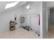 Finished bonus room with white walls, clothes rack, storage baskets, and a skylight at 513 38Th Ave. N # 202, Myrtle Beach, SC 29577