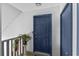 Blue condo entry door with visible unit number and a fire extinguisher at 513 38Th Ave. N # 202, Myrtle Beach, SC 29577