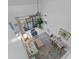 An aerial view of a modern living and dining area, with a blend of textures and natural light at 513 38Th Ave. N # 202, Myrtle Beach, SC 29577