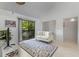 Comfortable living room featuring a sofa, TV, and a view of the outdoors through a sliding door at 513 38Th Ave. N # 202, Myrtle Beach, SC 29577