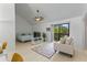 Open concept living and bedroom area with light floors and a sliding glass door to balcony at 513 38Th Ave. N # 202, Myrtle Beach, SC 29577