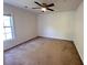 Cozy bedroom with plush carpeting, a ceiling fan, and a window for natural light at 514 Hay Hill Ln. # C, Myrtle Beach, SC 29579