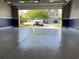 Garage featuring a painted floor, two-tone walls and a view to the property beyond at 514 Hay Hill Ln. # C, Myrtle Beach, SC 29579