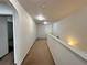 Neutral carpeted hallway with bright lighting and white trim at 514 Hay Hill Ln. # C, Myrtle Beach, SC 29579