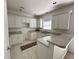Bright kitchen featuring white cabinets, ample counter space, and tile flooring at 514 Hay Hill Ln. # C, Myrtle Beach, SC 29579