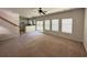 Open-concept living room with ample natural light and staircase view at 514 Hay Hill Ln. # C, Myrtle Beach, SC 29579
