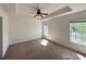 Spacious main bedroom with ceiling fan, tray ceiling, and natural lighting at 514 Hay Hill Ln. # C, Myrtle Beach, SC 29579