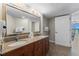 Modern bathroom with double sinks, granite countertops, and large mirror at 5200 N Ocean Blvd. # 632, Myrtle Beach, SC 29577