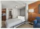 Bedroom with a gray pullout bed, loveseat, and access to the bathroom at 5200 N Ocean Blvd. # 632, Myrtle Beach, SC 29577