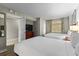 Bright bedroom featuring two beds, wooden dresser, and outside view at 5200 N Ocean Blvd. # 632, Myrtle Beach, SC 29577