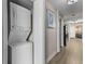 Hallway with a stacked washer and dryer unit, as well as access to other rooms at 5200 N Ocean Blvd. # 632, Myrtle Beach, SC 29577