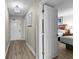 Bright hallway leading to bedroom and entry with attractive light fixture and wood-look floors at 5200 N Ocean Blvd. # 632, Myrtle Beach, SC 29577