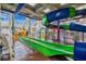Indoor waterpark with slides, play structures, and a submarine-themed feature under a skylight at 5200 N Ocean Blvd. # 632, Myrtle Beach, SC 29577