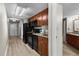 Compact kitchen features wood cabinets, granite counters, and black appliances at 5200 N Ocean Blvd. # 632, Myrtle Beach, SC 29577