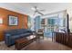 Bright living room with blue sofa, brown accent chair, and balcony access at 5200 N Ocean Blvd. # 632, Myrtle Beach, SC 29577