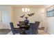 Cozy dining area featuring stylish gray chairs, a wooden table, and elegant decorative elements at 540 Duvall St., Longs, SC 29568