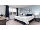 Tranquil primary bedroom offering a peaceful retreat with serene blue accents and natural light at 540 Duvall St., Longs, SC 29568