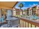 Private balcony featuring outdoor seating with pool and community view at 5507 N Ocean Blvd. # 105, Myrtle Beach, SC 29577