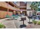 Outdoor courtyard featuring tables, chairs, grills, and lush landscaping at 5507 N Ocean Blvd. # 105, Myrtle Beach, SC 29577