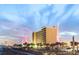 Oceanfront resort featuring a boardwalk, a Ferris wheel, and amazing ocean views at sunset at 5507 N Ocean Blvd. # 105, Myrtle Beach, SC 29577