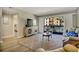 Bright living room featuring sliding glass doors to the balcony, a patterned rug, and comfortable seating at 5507 N Ocean Blvd. # 105, Myrtle Beach, SC 29577