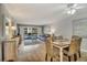 Spacious living and dining area with balcony access, comfortable seating, and stylish decor at 5507 N Ocean Blvd. # 105, Myrtle Beach, SC 29577