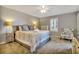 Comfortable main bedroom with a large bed, soft lighting, and a ceiling fan at 5507 N Ocean Blvd. # 105, Myrtle Beach, SC 29577