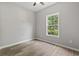 Neutral bedroom featuring a ceiling fan, a window and luxury vinyl plank flooring at 561 Bucks Trail, Longs, SC 29568