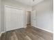Bedroom with closet, wood-look floors, and neutral paint at 561 Bucks Trail, Longs, SC 29568