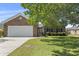 Charming brick home with a two-car garage and well-maintained lawn and garden at 561 Bucks Trail, Longs, SC 29568