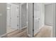 Hallway with wood-look flooring leading to the bathroom and main living area at 561 Bucks Trail, Longs, SC 29568