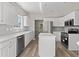 Modern kitchen with white cabinets, stainless steel appliances, and a center island at 561 Bucks Trail, Longs, SC 29568