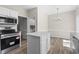 Modern kitchen featuring stainless steel appliances and a kitchen island at 561 Bucks Trail, Longs, SC 29568