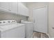 A dedicated laundry area featuring a full size washer and dryer and plenty of storage at 561 Bucks Trail, Longs, SC 29568