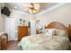 Comfortable bedroom with tropical bedding, wooden furniture, and beach-themed decor, creating a relaxing ambiance at 6001-1783 S Kings Hwy., Myrtle Beach, SC 29575