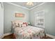 Comfortable bedroom with a queen bed, ceiling fan, and natural light at 6001-1783 S Kings Hwy., Myrtle Beach, SC 29575