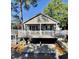 Charming coastal home featuring a spacious porch and a driveway underneath, perfect for outdoor living at 6001-1783 S Kings Hwy., Myrtle Beach, SC 29575
