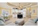 Open-concept living room with tile flooring, comfortable seating, and seamless flow to the dining area at 6001-1783 S Kings Hwy., Myrtle Beach, SC 29575