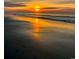 Stunning sunrise over the ocean, reflecting vibrant colors on the water and wet sand at 6001-1783 S Kings Hwy., Myrtle Beach, SC 29575