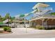 Exterior shot of a tall, winding green and white water slide, part of community amenities at 6001-1783 S Kings Hwy., Myrtle Beach, SC 29575