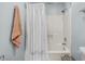 Bathroom with a white shower curtain and a peach colored towel hanging near the shower at 6001-7035 S Kings Hwy., Myrtle Beach, SC 29575