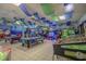 Spacious game room with pool tables, air hockey, arcade games, and ocean themed decorations at 6001-7035 S Kings Hwy., Myrtle Beach, SC 29575