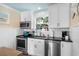 Modern kitchen features stainless steel appliances, white subway tile backsplash, and ample counter space at 6001-7035 S Kings Hwy., Myrtle Beach, SC 29575