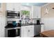 Modern kitchen features stainless steel appliances, white subway tile backsplash, and ample counter space at 6001-7035 S Kings Hwy., Myrtle Beach, SC 29575