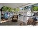 Relaxing porch with comfortable wicker furniture for outdoor enjoyment at 6001-7035 S Kings Hwy., Myrtle Beach, SC 29575