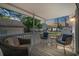Covered porch featuring comfortable seating and neighborhood views at sunset at 6001-7035 S Kings Hwy., Myrtle Beach, SC 29575